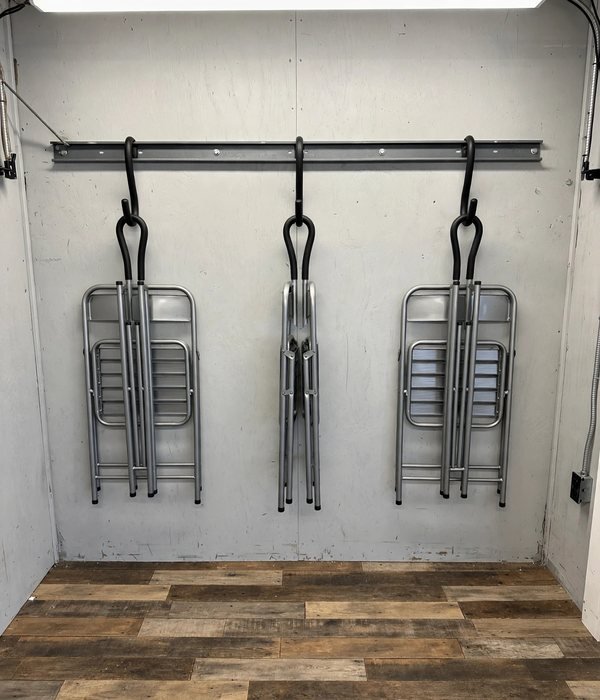 9 Extra Seating and Folding Table Storage Ideas for Holiday Hosting 4 Hang Chairs on a Stud-Mounted Hook Rail in the Garage or Closet – folding chair storage