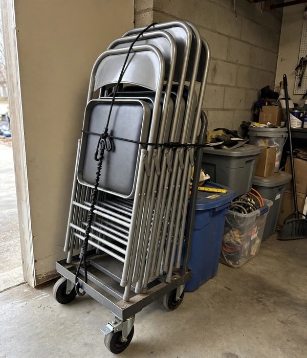 9 Extra Seating and Folding Table Storage Ideas for Holiday Hosting 7 Roll Them Away on a Chair Dolly – folding chair storage